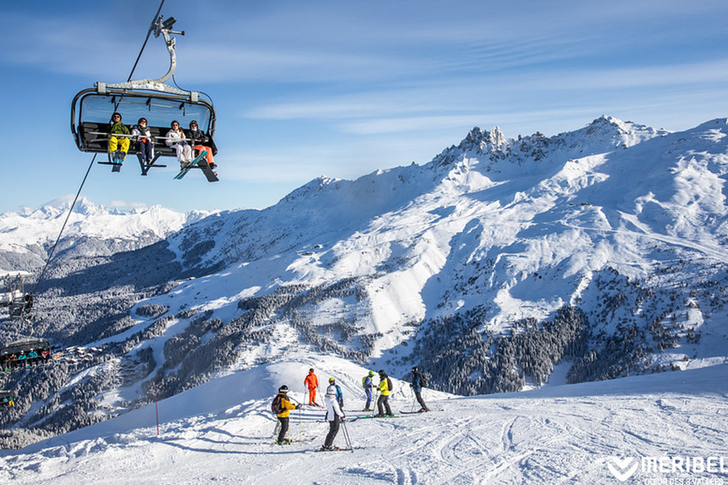 Chair lift & skiers in Meribel valley
