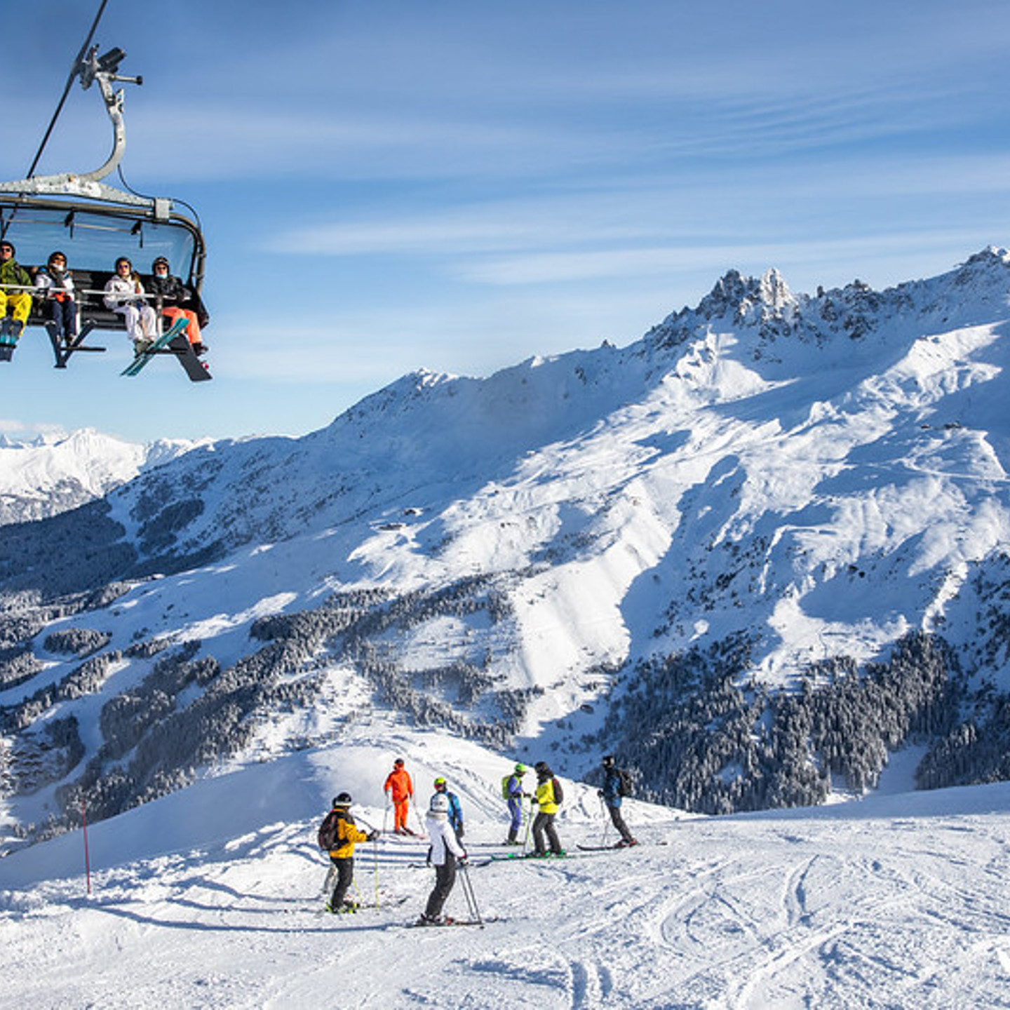 Chair lift & skiers in Meribel valley